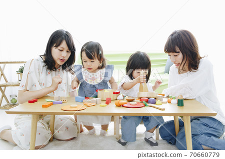 Parent and child playing with toys Parent and child playing with toys 70660779