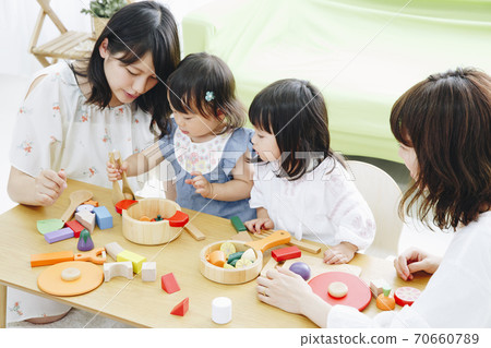 Parent and child playing with toys 70660789