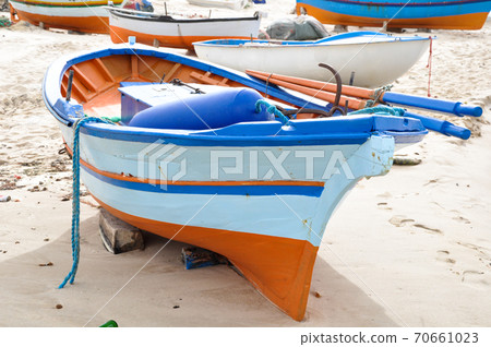 Hammamet, Tunisia- February 07, 2009: Tunisian Fishing boats on the beach with their traditional colors. 70661023
