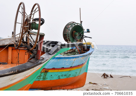 Hammamet, Tunisia- February 07, 2009: Tunisian Fishing boats on the beach with their traditional colors. 70661035