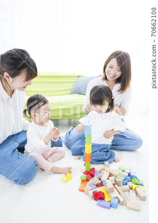 Parents and children playing Parents and children playing 70662108