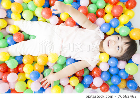 Infants playing in the ball pool 70662462