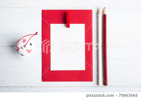 Blank red envelope and white Christmas toys Blank red envelope and white Christmas toys 70663668