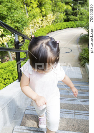 Girls climbing stairs Girls climbing stairs 70663830