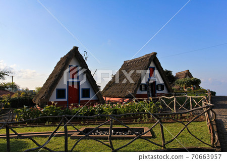 SANTANA, MADEIRA, PORTUGAL Traditional Madeira building with thatched roof. SANTANA, MADEIRA, PORTUGAL Traditional Madeira building with thatched roof. 70663957