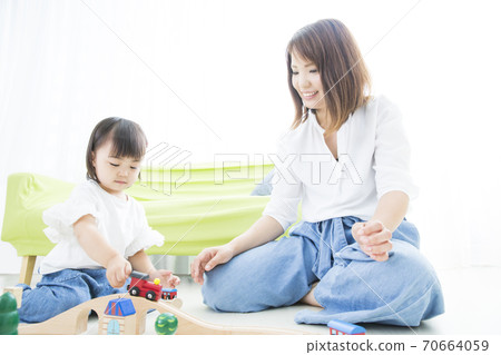 Infants playing with toys Infants playing with toys 70664059