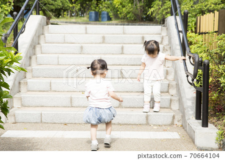 Girl playing outside 70664104