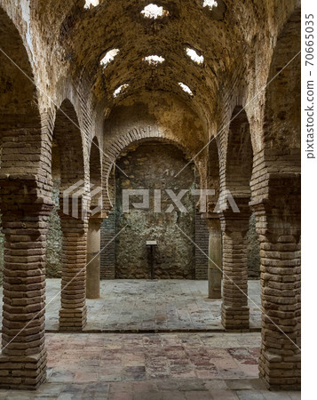 Columns in the ancient Arab baths in Ronda, Andalusia, Spain Columns in the ancient Arab baths in Ronda, Andalusia, Spain 70665035