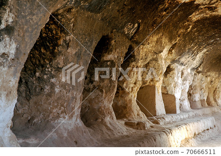 Takht-e Rostam (Takht-e Rustam) is a stupa monastery in northern Afghanistan. Inside the cave monastery showing the cave system. Takht e Rostam is between Mazar i Sharif and Pol e Khomri, Afghanistan. Takht-e Rostam (Takht-e Rustam) is a stupa monastery in northern Afghanistan. Inside the cave monastery showing the cave system. Takht e Rostam is between Mazar i Sharif and Pol e Khomri, Afghanistan. 70666511