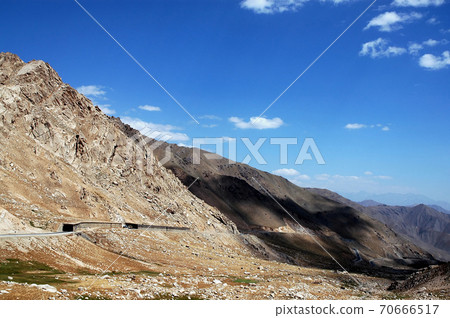 The Salang Pass to the south of the Salang Tunnel in Parwan Province, Afghanistan. This scenic road connects traffic from northern Afghanistan with Kabul and cuts through the Hindu Kush mountains. The Salang Pass to the south of the Salang Tunnel in Parwan Province, Afghanistan. This scenic road connects traffic from northern Afghanistan with Kabul and cuts through the Hindu Kush mountains. 70666517