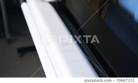 White paper drawing pressed in plotter, sewing atelier studio White paper drawing pressed in plotter, sewing atelier studio 70667151