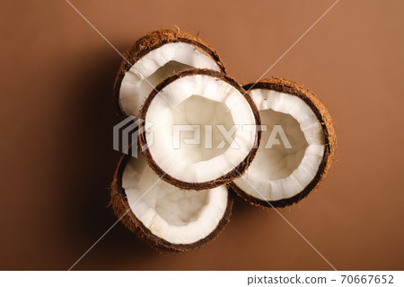 Coconut fruits on brown plain background, abstract food tropical concept, top view 70667652