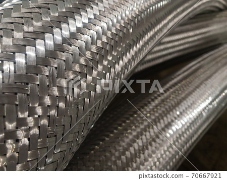 Long metal flexible compensator pipes close up Long metal flexible compensator pipes close up 70667921