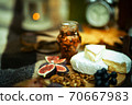 Close-up detail of figs, grapes,cheese, walnuts 70667983