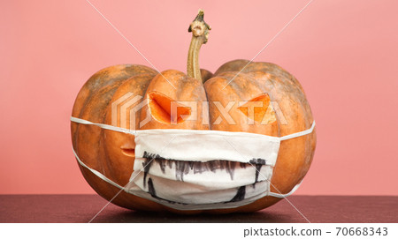 halloween pumpkins with medical mask on pink background copy space halloween pumpkins with medical mask on pink background copy space 70668343