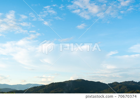 The white clouds have a strange shape and moutain. The white clouds have a strange shape and moutain. 70670374