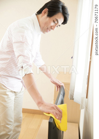 A man cleaning A man cleaning 70671179
