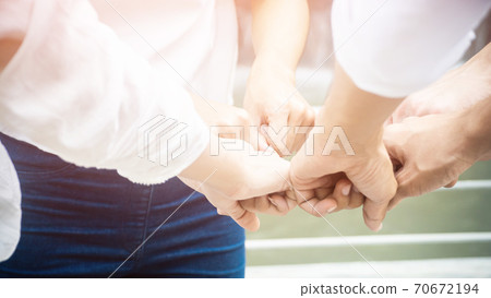 Team teamwork business join hand together concept, Power of male and female volunteer charity work 70672194