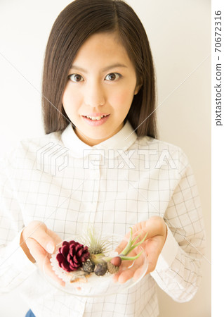 Woman with airplants Woman with airplants 70672316