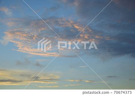 Interestingly shaped sunrise clouds at sunrise Interestingly shaped sunrise clouds at sunrise 70674373