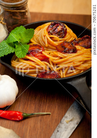 italian spaghetti pasta and tomato with mint leaves 70675281