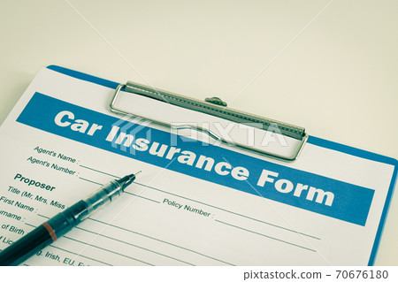 Car Insurance Claim Form or Insurance Document and Pen at Left Frame in Vintage Tone Car Insurance Claim Form or Insurance Document and Pen at Left Frame in Vintage Tone 70676180