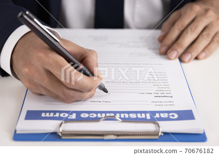 Zoom Insurance Agent Hand Writing Car Insurance Claim Form or Document Zoom Insurance Agent Hand Writing Car Insurance Claim Form or Document 70676182