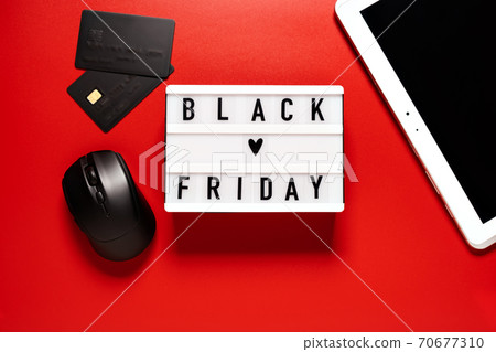 Black friday sale word on lightbox on a red background Black friday sale word on lightbox on a red background 70677310