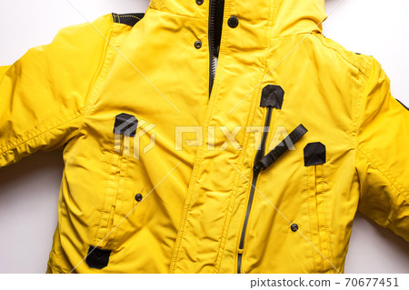 Winter men's yellow jacket on a white background. Winter men's yellow jacket on a white background. 70677451