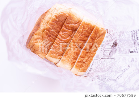Take a picture. Sliced bread in the wrapping paper. 70677589