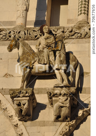 St. Martin on the facade of the San Martino Cathedral in Lucca, Italy St. Martin on the facade of the San Martino Cathedral in Lucca, Italy 70677656