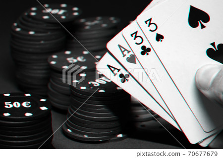 cards with two pairs in the hands of the player in a game of poker on the background of gaming chips cards with two pairs in the hands of the player in a game of poker on the background of gaming chips 70677679