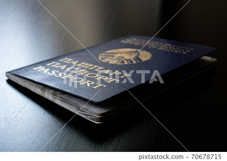 Belarusian passport on wooden table close up Belarusian passport on wooden table close up 70678715