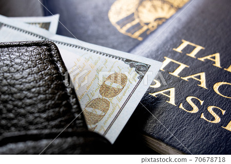Belarusian passport and money dollars on wooden table Belarusian passport and money dollars on wooden table 70678718