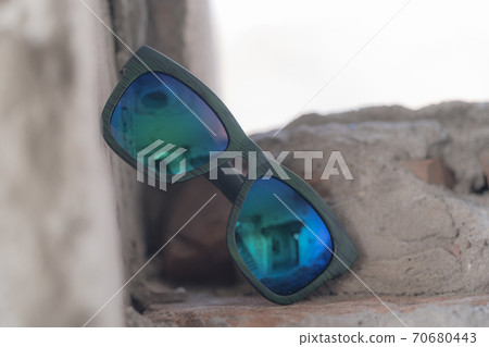 Classic sunglasses model shoot in creative indoor place closeup. Selective focus 70680443