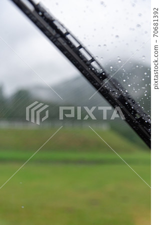 A wiper that wipes water droplets on the windshield A wiper that wipes water droplets on the windshield 70681392