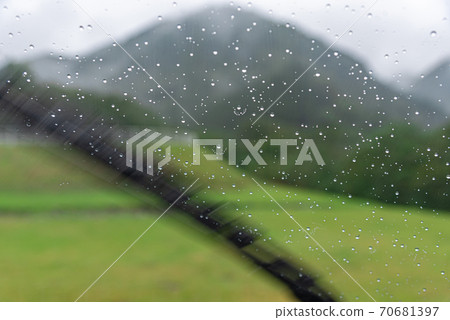 A wiper that wipes water droplets on the windshield A wiper that wipes water droplets on the windshield 70681397