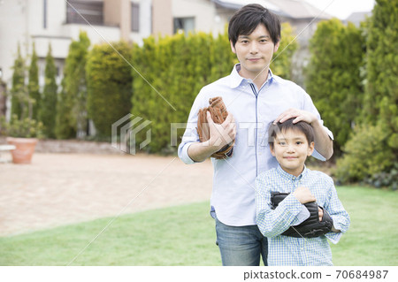Father and son playing catch 70684987