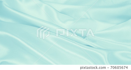 Smooth elegant blue silk or satin luxury cloth texture as abstract background. Luxurious background design Smooth elegant blue silk or satin luxury cloth texture as abstract background. Luxurious background design 70685674