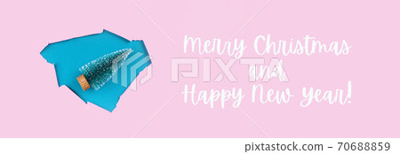 Toy christmas tree in Aqua paper hole on pink 70688859