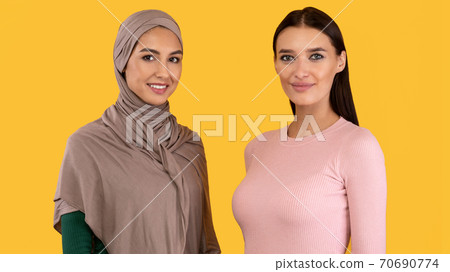 Muslim Women Posing Wearing Hijab And Modern Clothes In Studio Muslim Women Posing Wearing Hijab And Modern Clothes In Studio 70690774