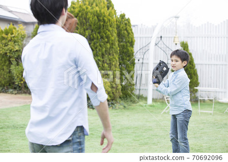 Father and son playing catch 70692096
