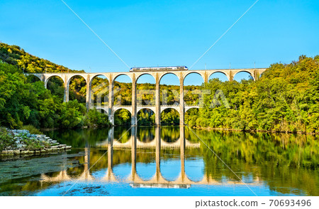Regional train on the Cize-Bolozon viaduct in France Regional train on the Cize-Bolozon viaduct in France 70693496