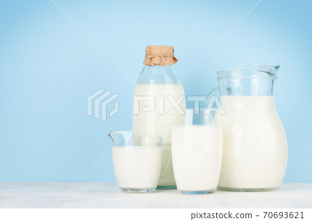 Milk in glass, bottle and jug Milk in glass, bottle and jug 70693621