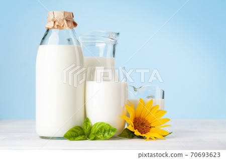 Milk in glass, bottle and jug 70693623