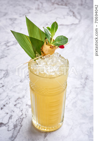 mai tai - classic alcohol long drink hawaiian cocktail at white marble background 70694042