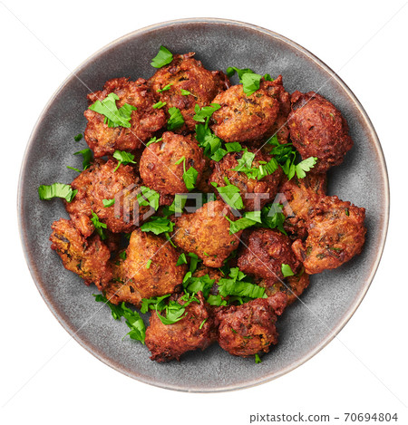 Veg Pakora in gray bowl isolated on white. Pakoda is indian cuisine deep fried dish. Asian food 70694804