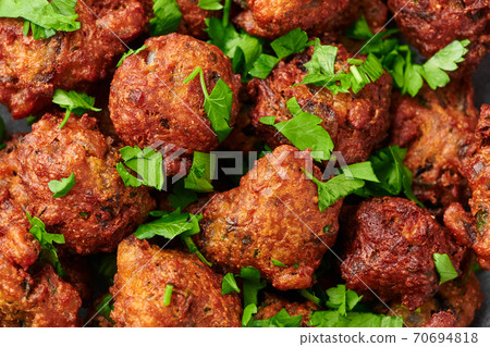 Veg Pakora close up. Pakoda is indian cuisine appetizer deep fried dish. Asian food and meal 70694818