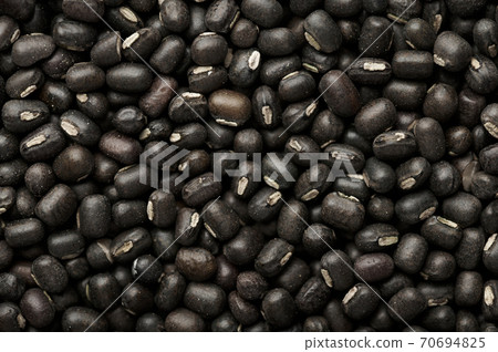 Black Gram or Urad Beans or Mung Beans texture. Vigna Mungo is popular indian cuisine food. 70694825