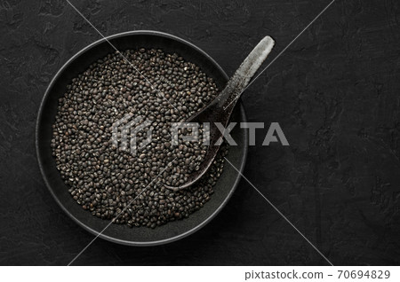 Black Gram or Urad Beans or Mung Beans in bowl on dark slate table top. Indian cuisine food Black Gram or Urad Beans or Mung Beans in bowl on dark slate table top. Indian cuisine food 70694829